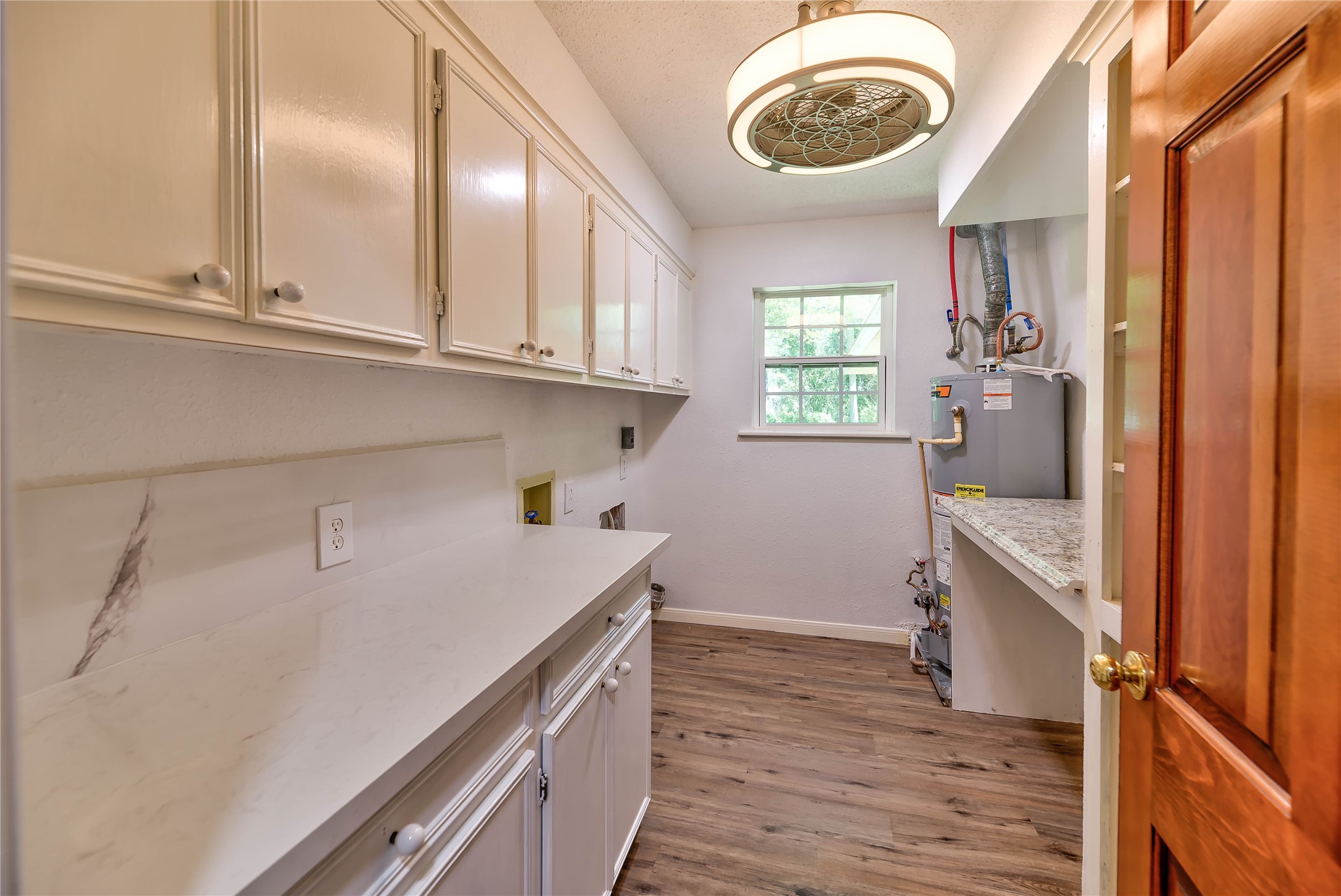 3003 Paul Knox Street Huntsville, TX 77320 - Photo 18 of 46 a kitchen with a sink a stove and cabinets