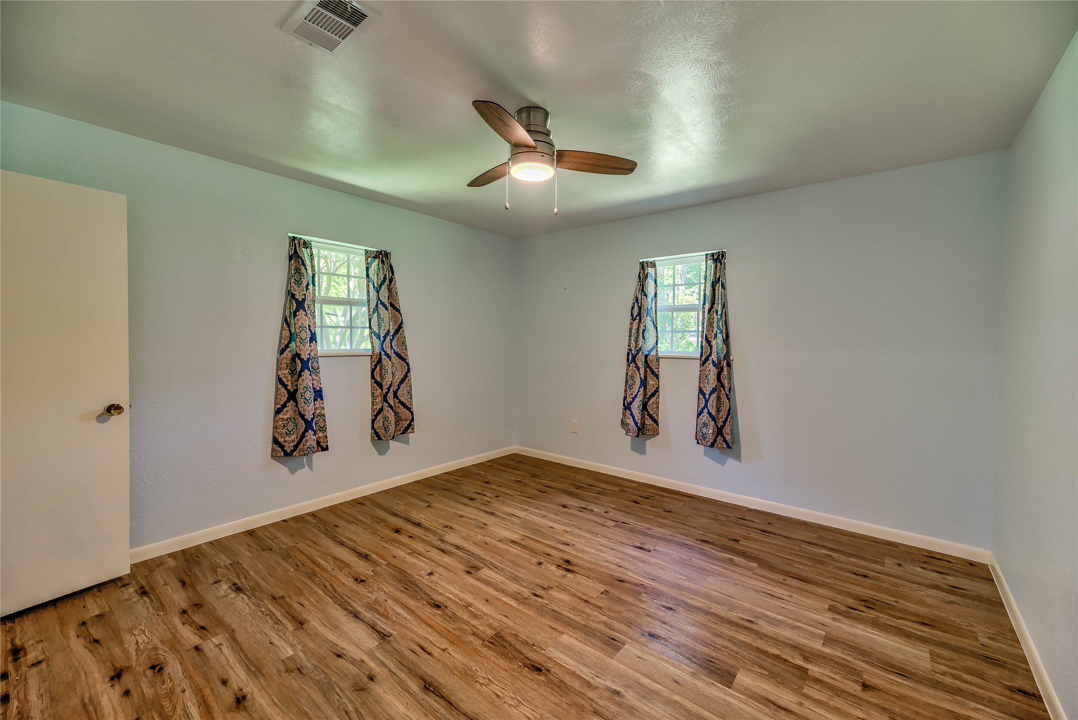 3003 Paul Knox Street Huntsville, TX 77320 - Photo 21 of 46 wooden floor in an empty room