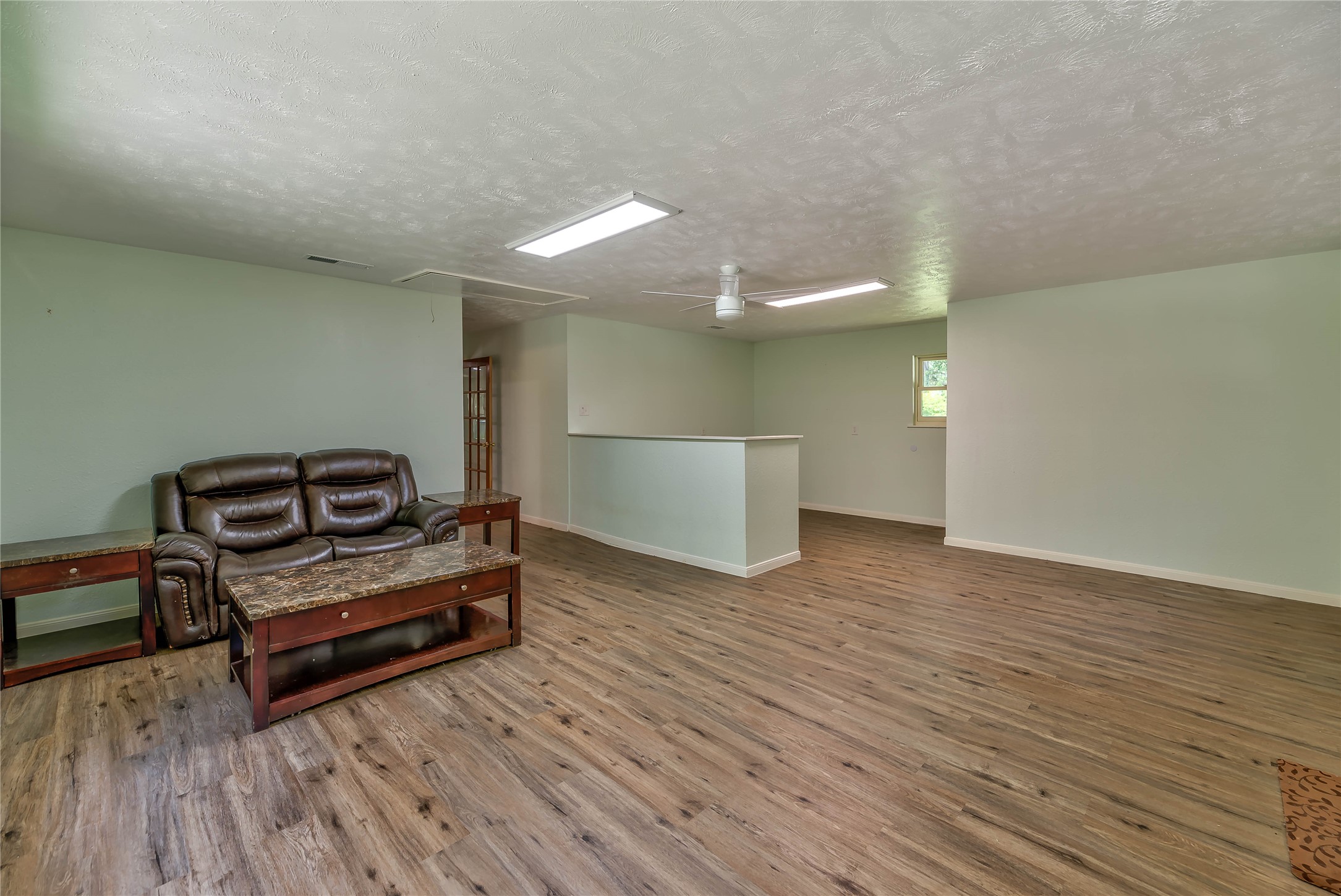 3003 Paul Knox Street Huntsville, TX 77320 - Photo 29 of 46 a living room with furniture and a wooden floor