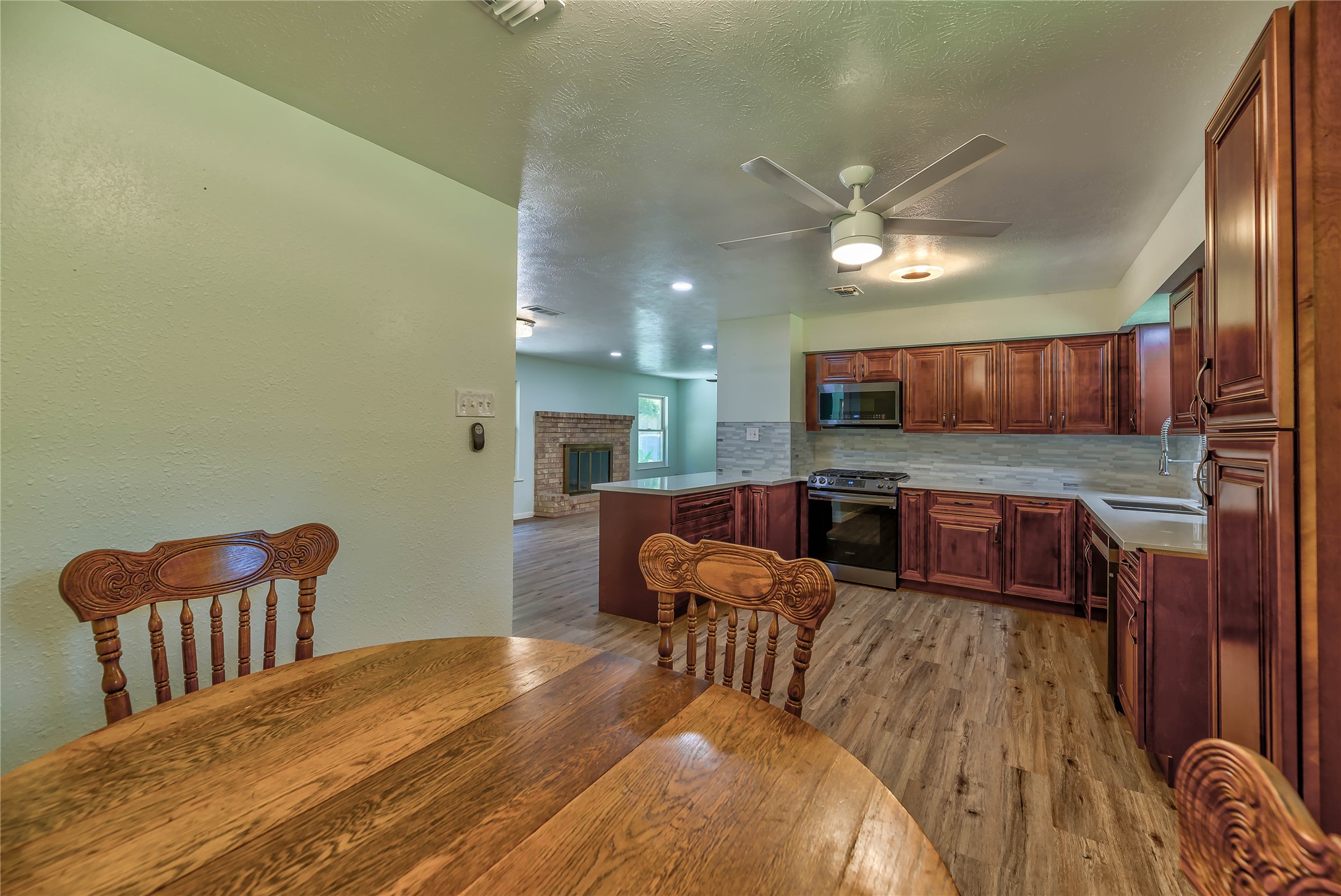 3003 Paul Knox Street Huntsville, TX 77320 - Photo 4 of 46 a living room with furniture and a wooden floor