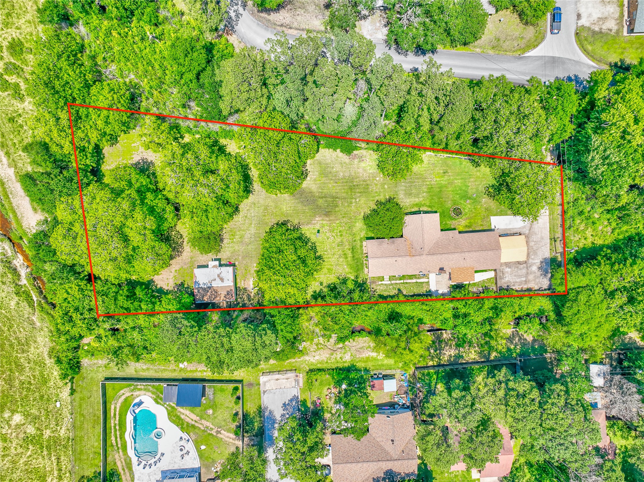 3003 Paul Knox Street Huntsville, TX 77320 - Photo 43 of 46 an aerial view of residential house with outdoor space and trees all around