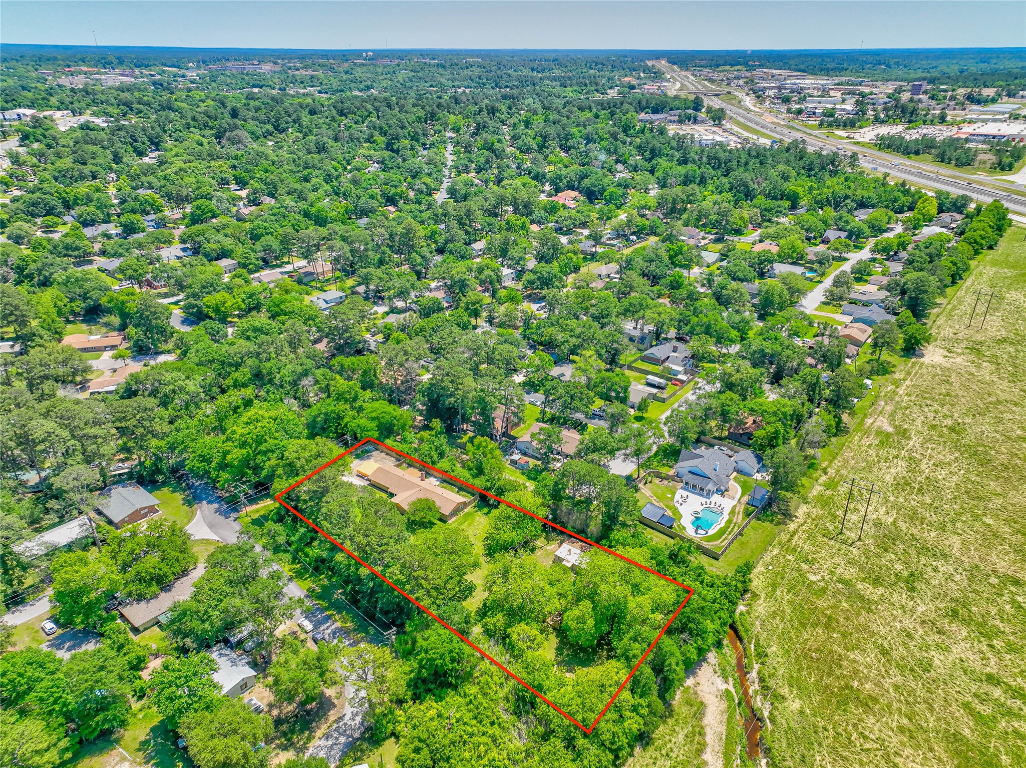 3003 Paul Knox Street Huntsville, TX 77320 - Photo 44 of 46 a view of a large yard with lots of green space