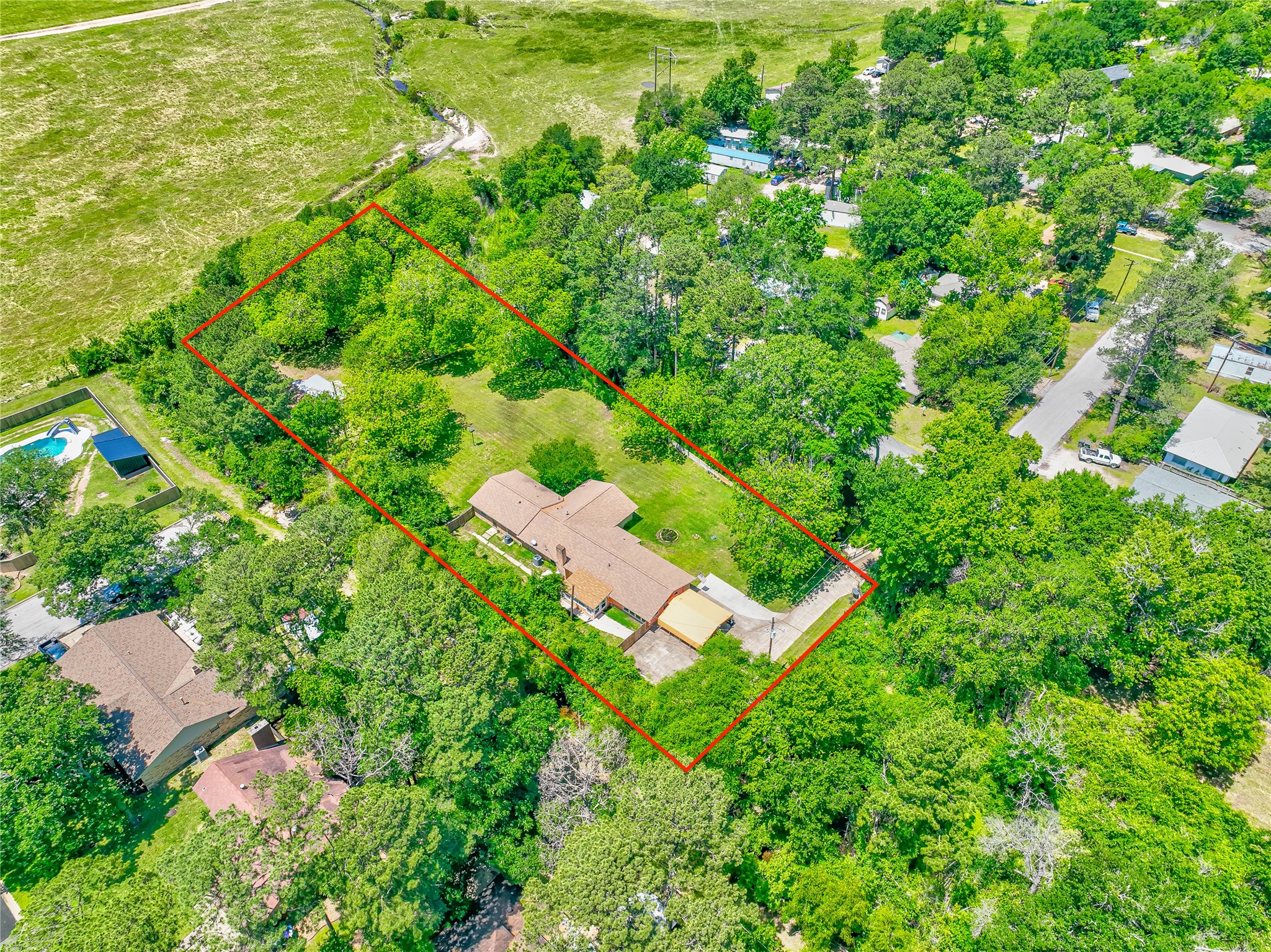 3003 Paul Knox Street Huntsville, TX 77320 - Photo 46 of 46 an aerial view of a house with yard