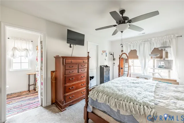 a bathroom with a sink vanity mirror and toilet