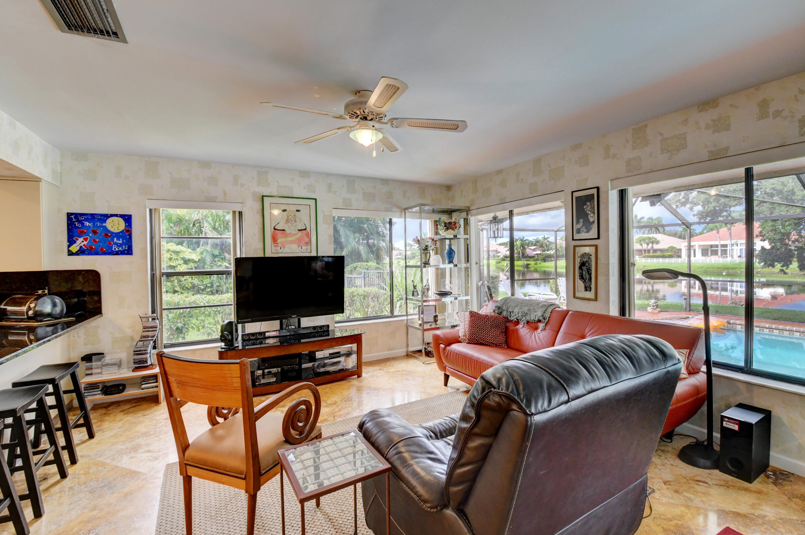 17331 Springtree Lane Boca Raton, FL 33487 - Photo 14 of 60 a living room with furniture and a flat screen tv