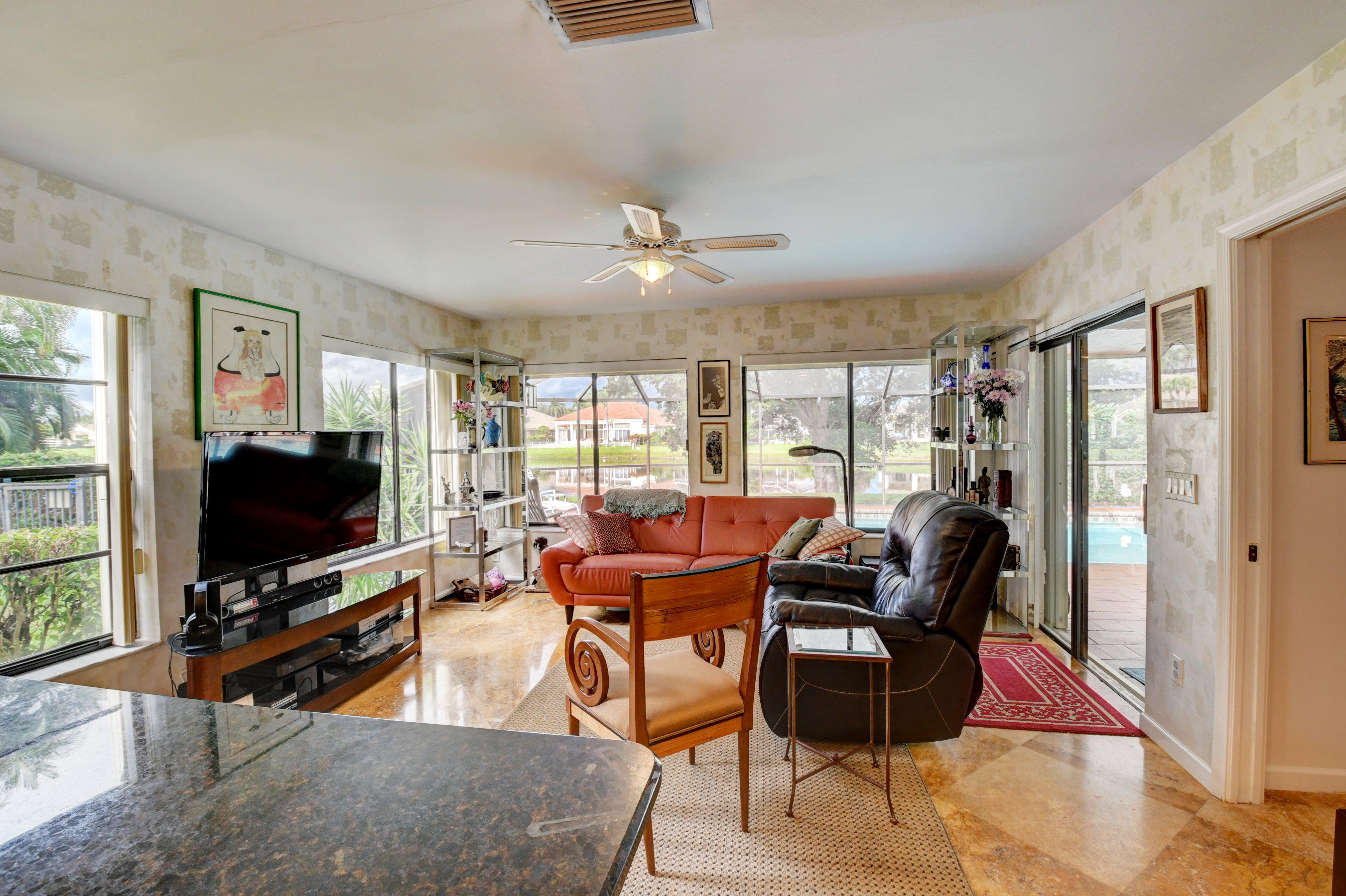17331 Springtree Lane Boca Raton, FL 33487 - Photo 15 of 60 a living room with furniture and a flat screen tv