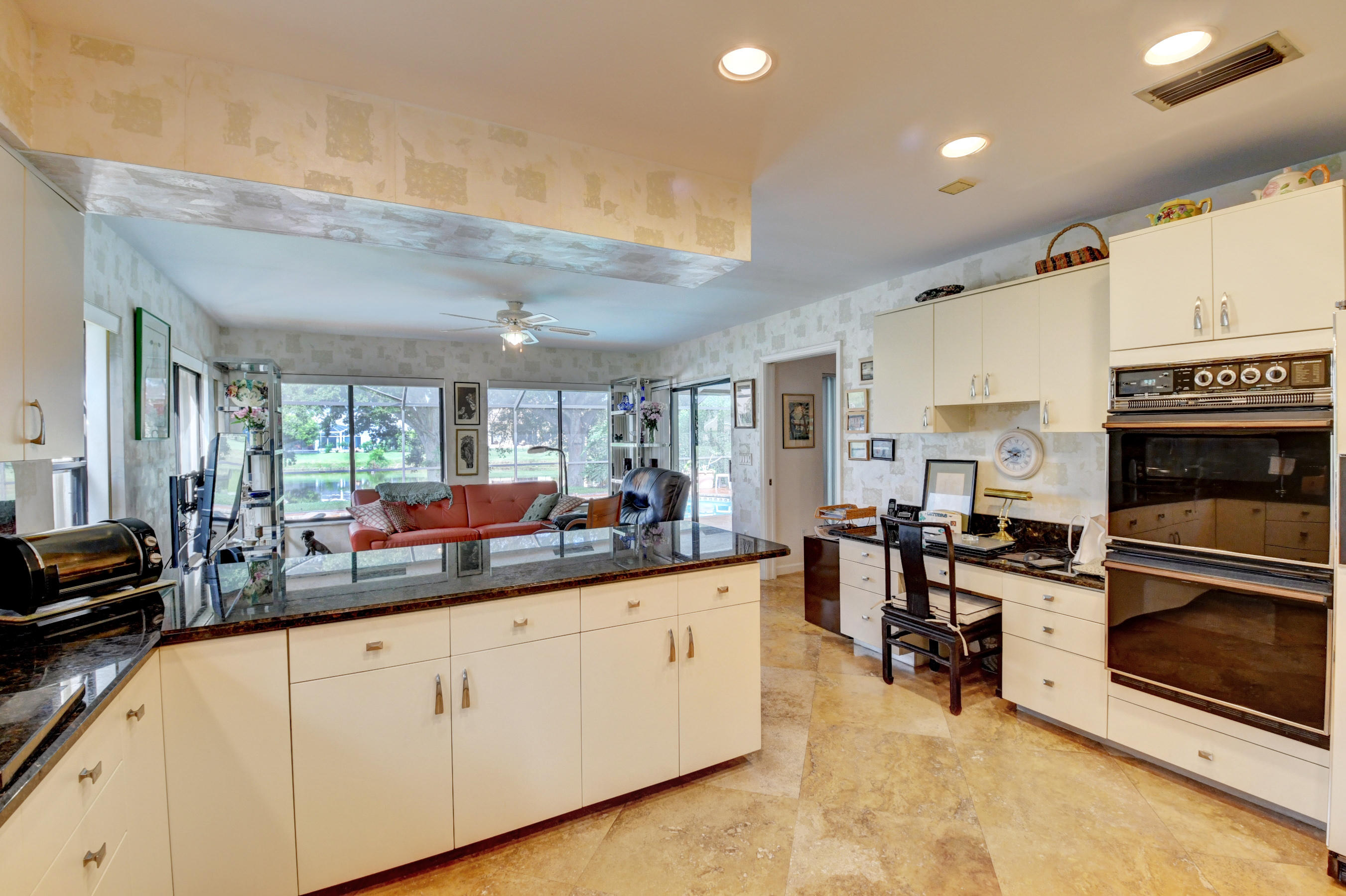 17331 Springtree Lane Boca Raton, FL 33487 - Photo 17 of 60 a kitchen with stainless steel appliances granite countertop a stove a sink and a refrigerator