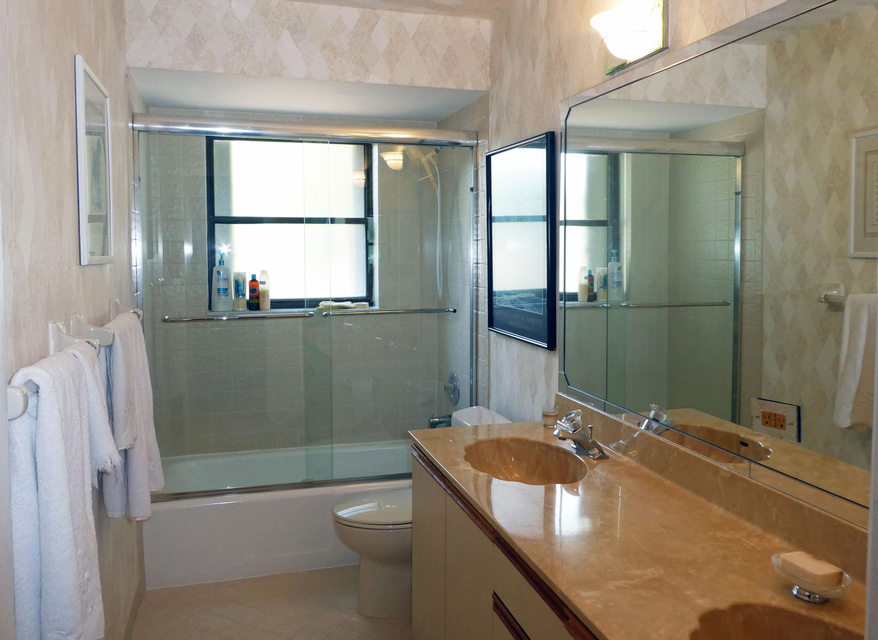 17331 Springtree Lane Boca Raton, FL 33487 - Photo 29 of 60 a bathroom with a granite countertop sink a toilet and shower