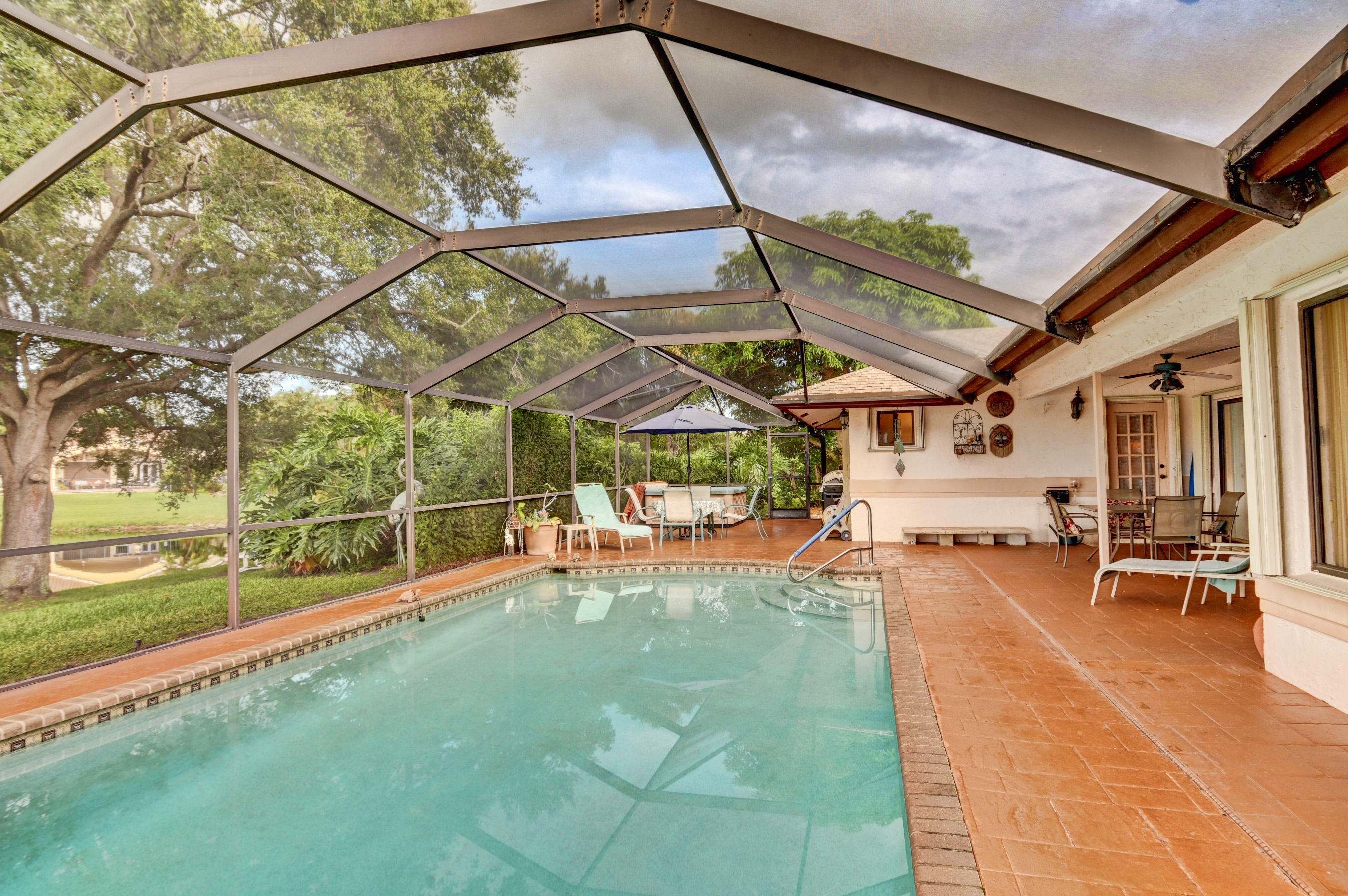 17331 Springtree Lane Boca Raton, FL 33487 - Photo 36 of 60 a view of a porch with a patio