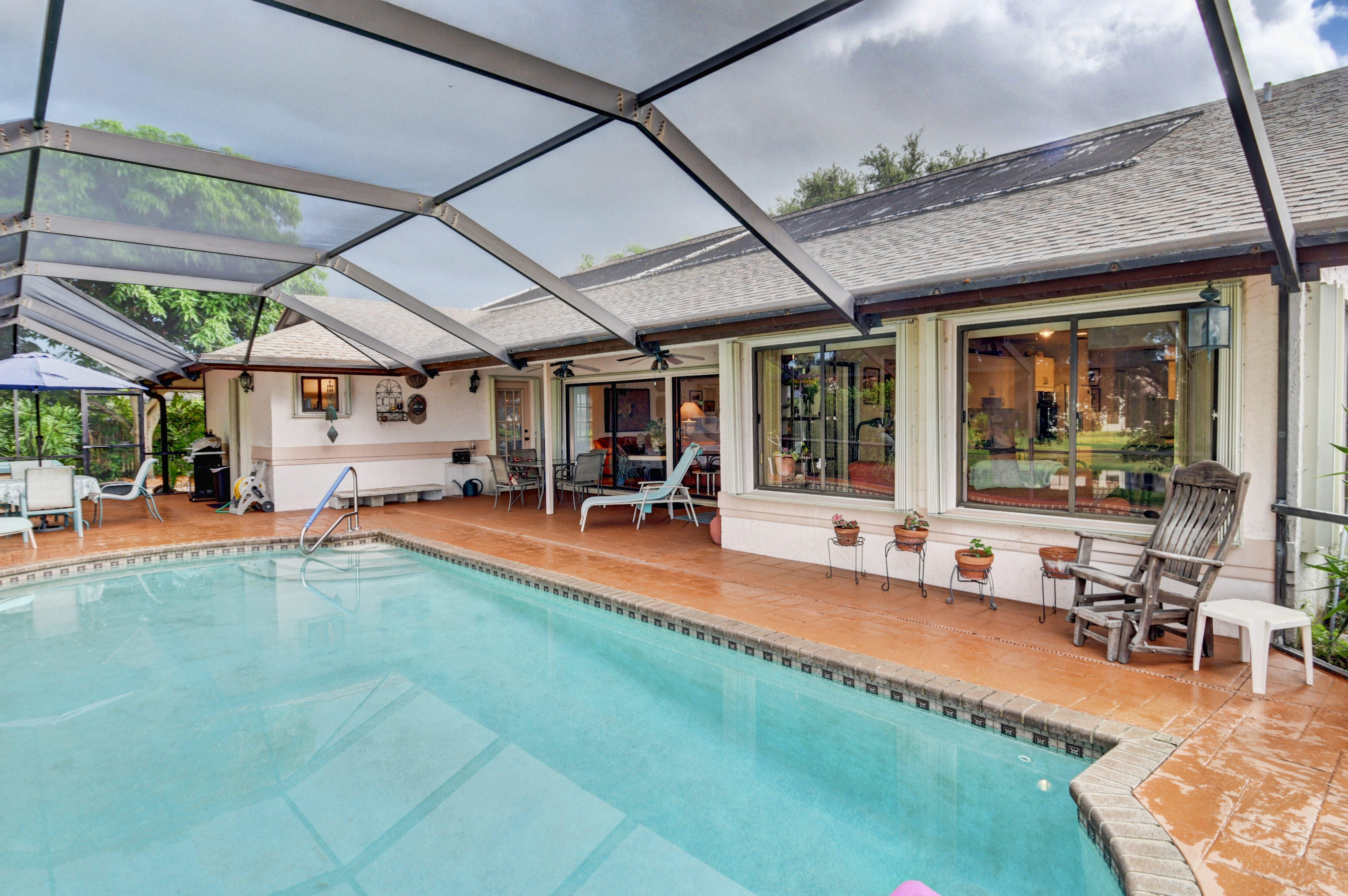 17331 Springtree Lane Boca Raton, FL 33487 - Photo 37 of 60 a view of swimming pool with outdoor seating