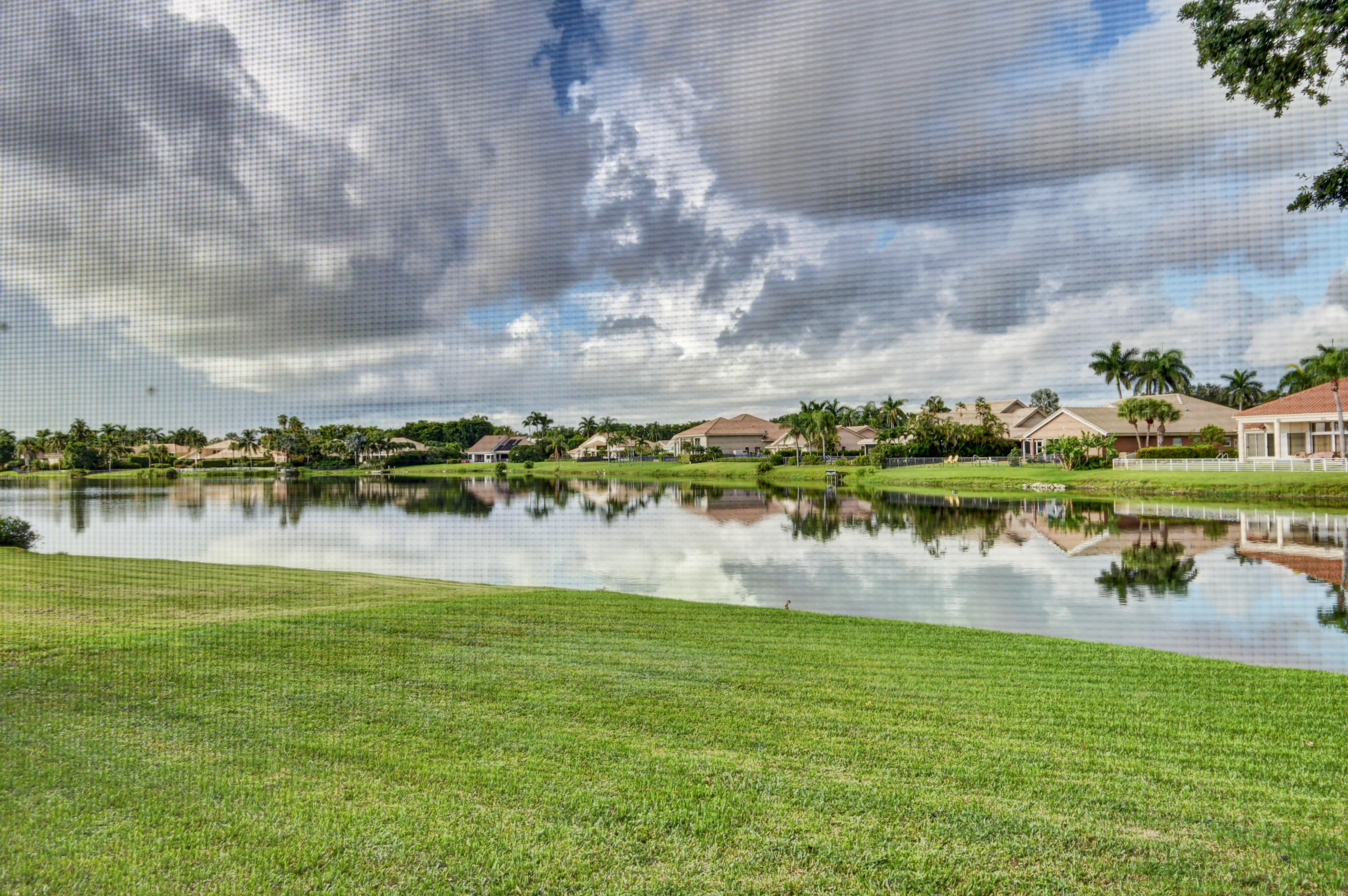 17331 Springtree Lane Boca Raton, FL 33487 - Photo 39 of 60 a view of lake with boats and trees