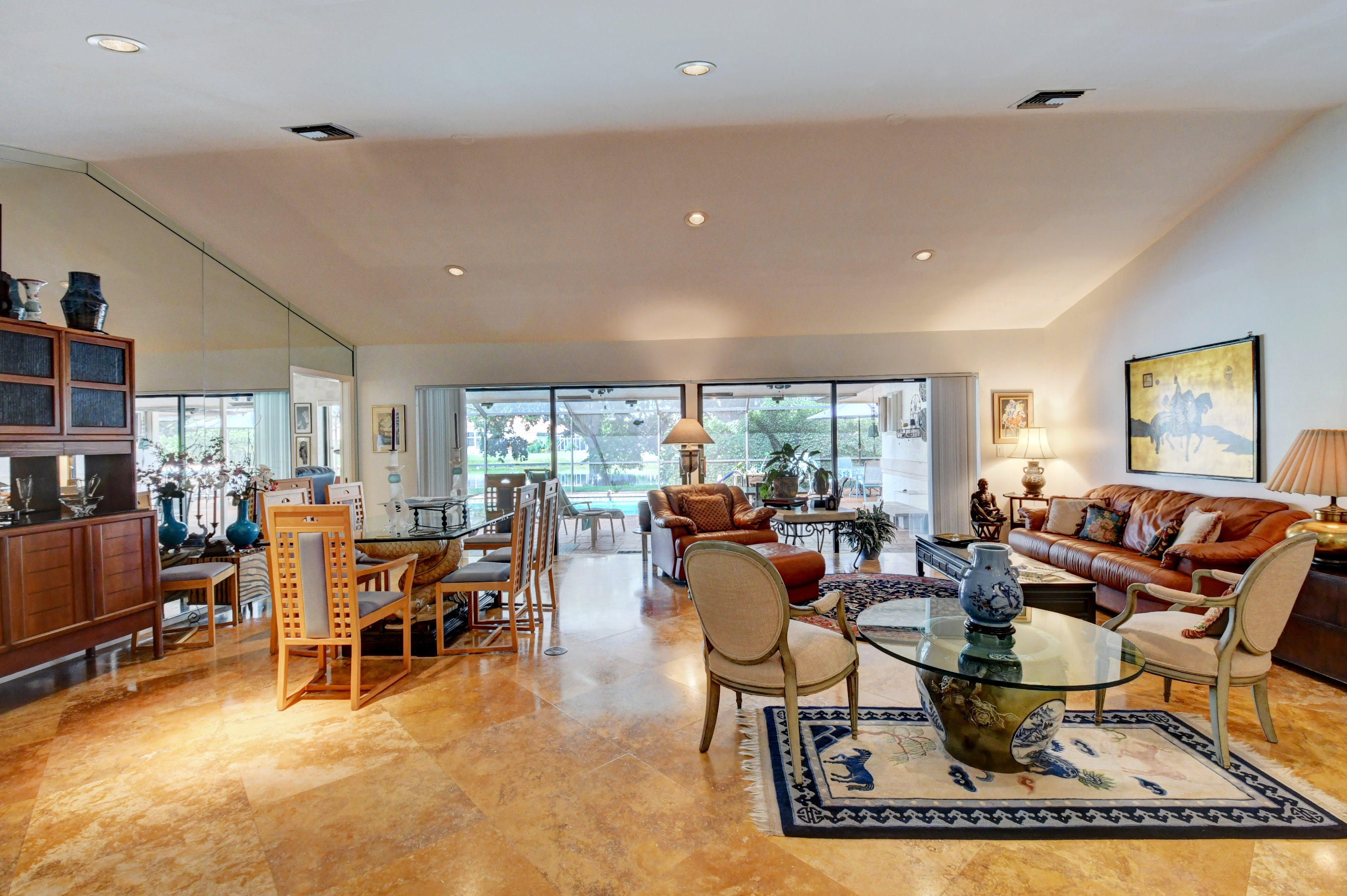 17331 Springtree Lane Boca Raton, FL 33487 - Photo 4 of 60 a living room with furniture and a large window