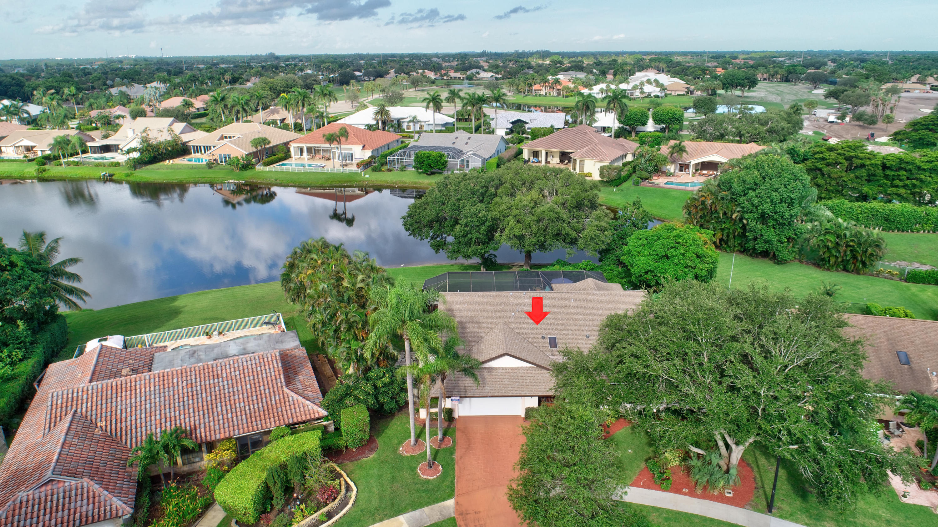 17331 Springtree Lane Boca Raton, FL 33487 - Photo 50 of 60 an aerial view of a house with a lake view