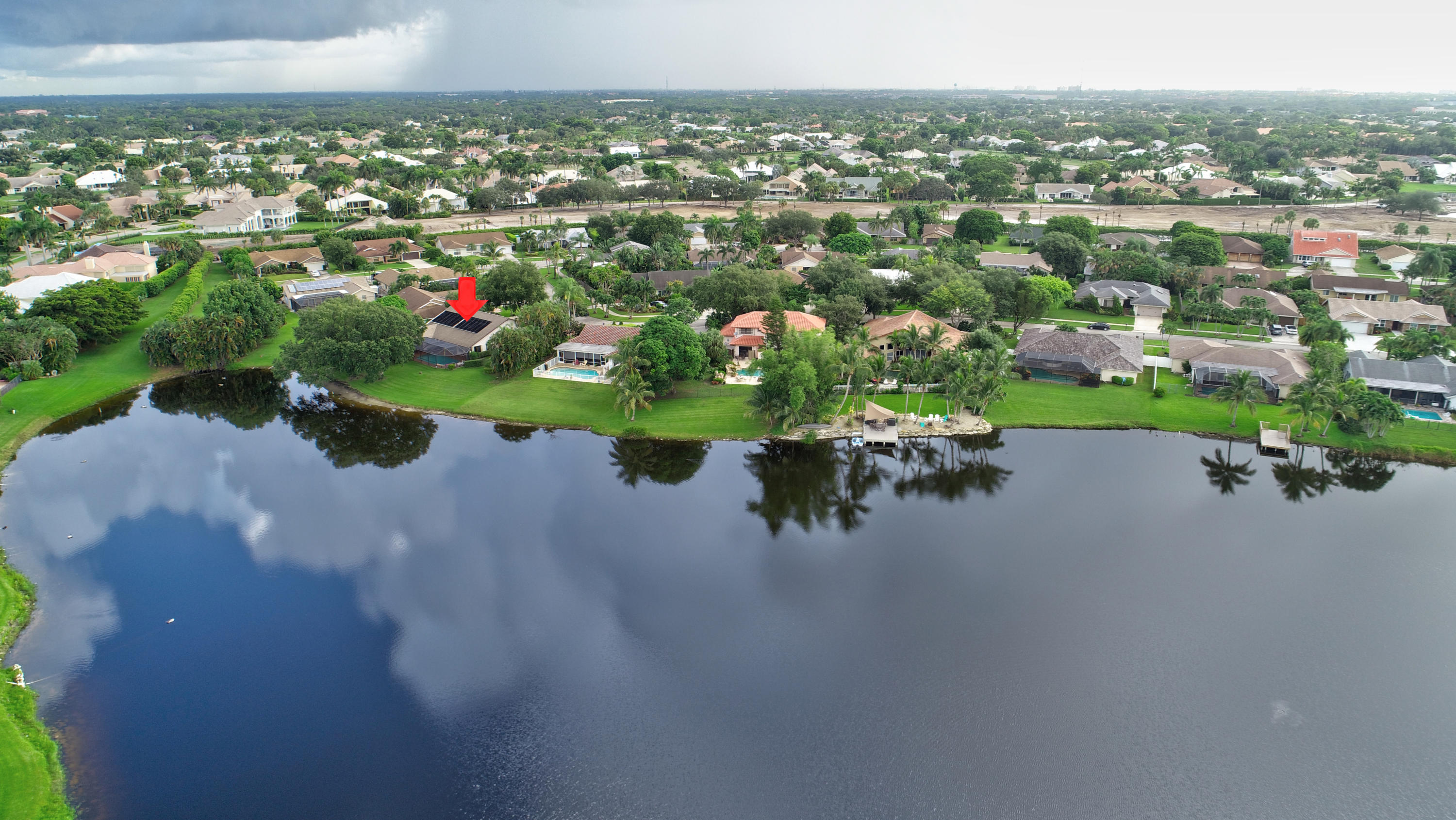 17331 Springtree Lane Boca Raton, FL 33487 - Photo 55 of 60 an aerial view of a house with a lake view