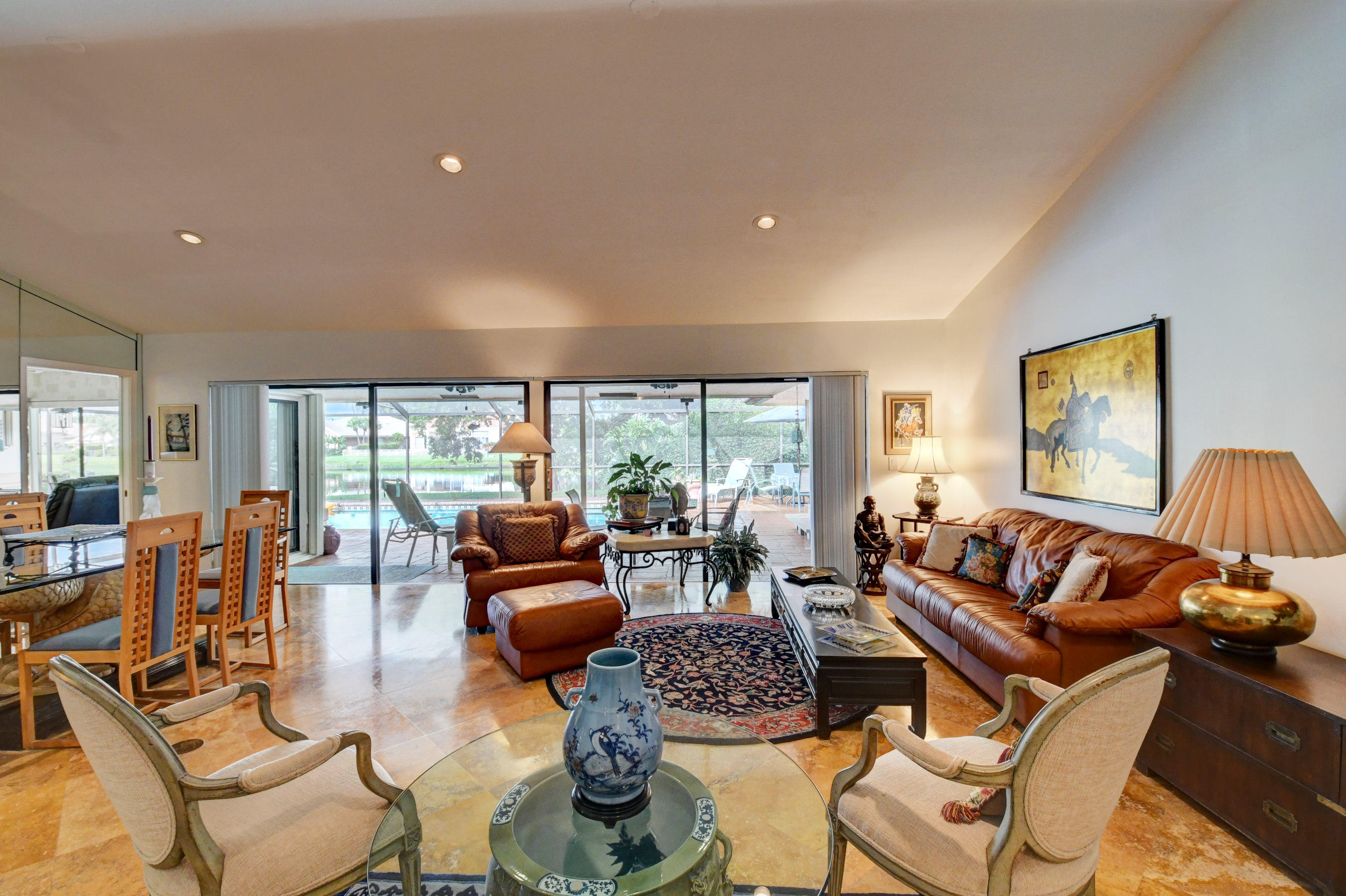 17331 Springtree Lane Boca Raton, FL 33487 - Photo 8 of 60 a living room with furniture and a large window