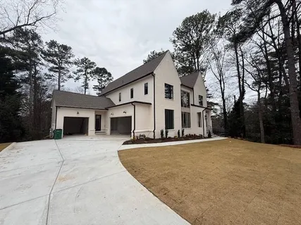a view of a house with a snow in the yard