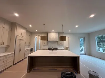 a kitchen with a sink stainless steel appliances and cabinets