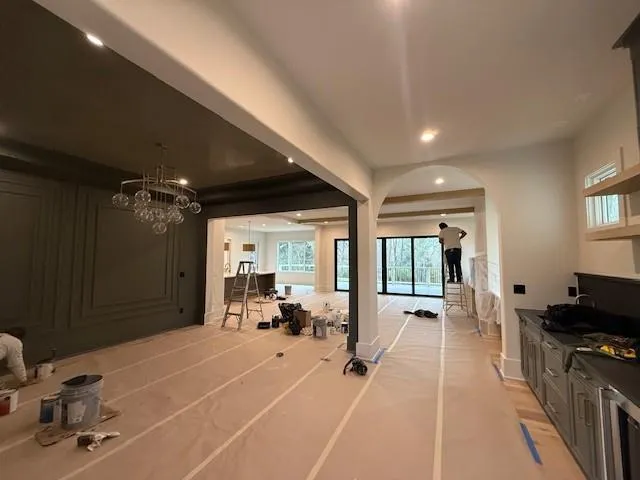 a room with gym equipment and a large window