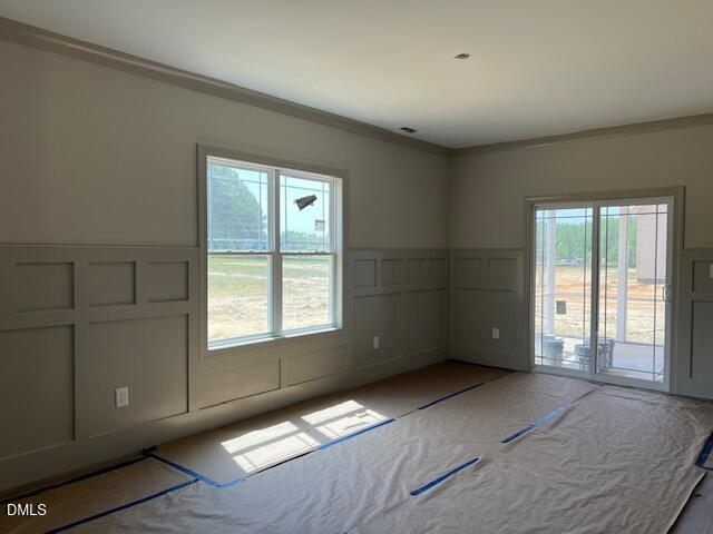 169 Big Pine Road Clayton, NC 27520 - Photo 5 of 14 an empty room with windows