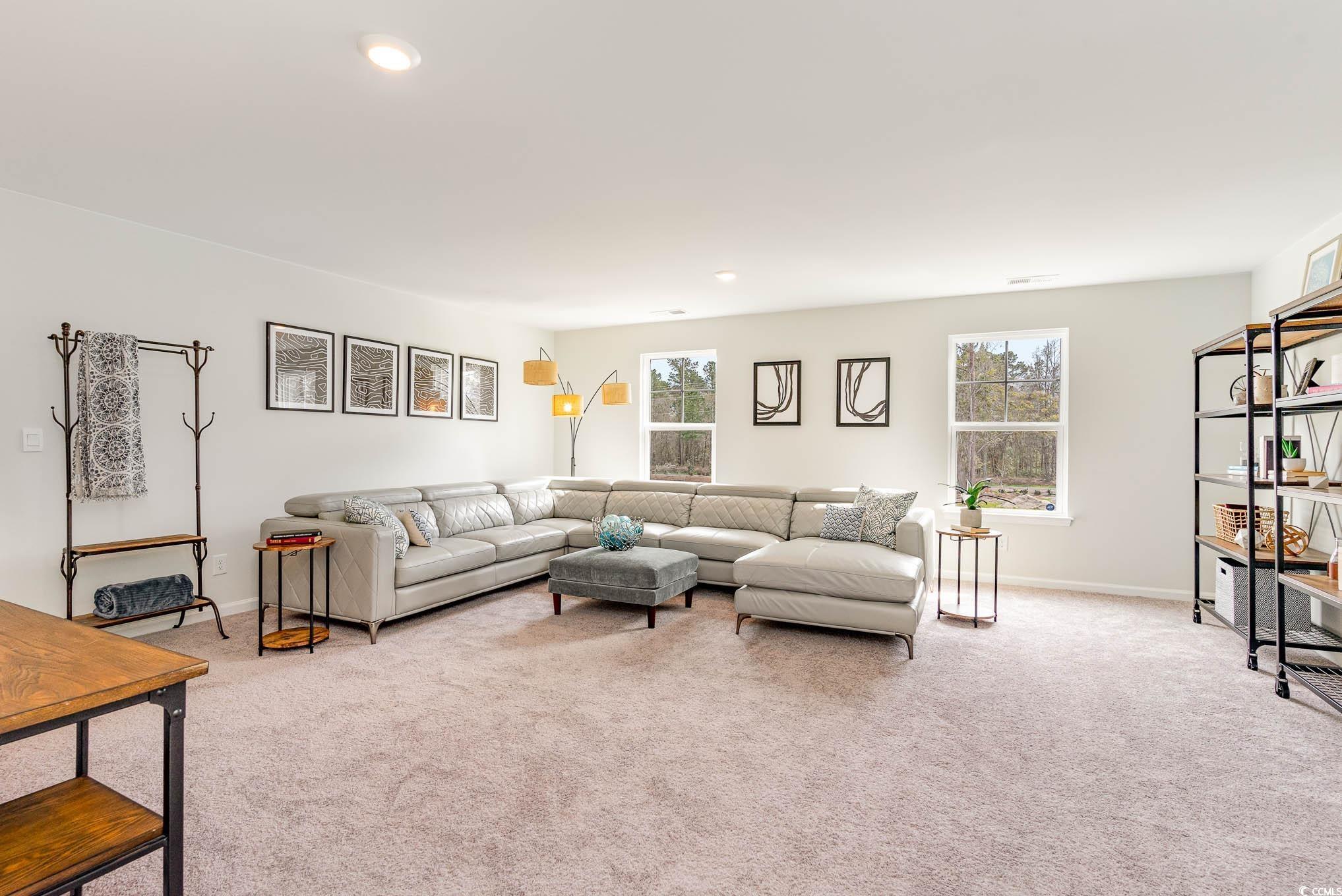 629 Anthem Court Conway, SC 29527 - Photo 32 of 40 Living room featuring light colored carpet and recessed lighting