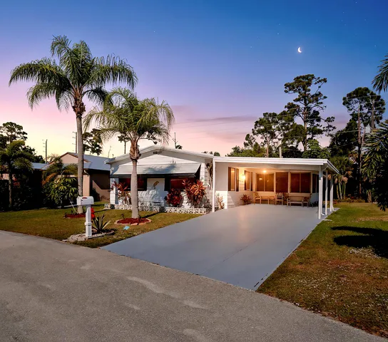 a view of a house with outdoor space and sitting area