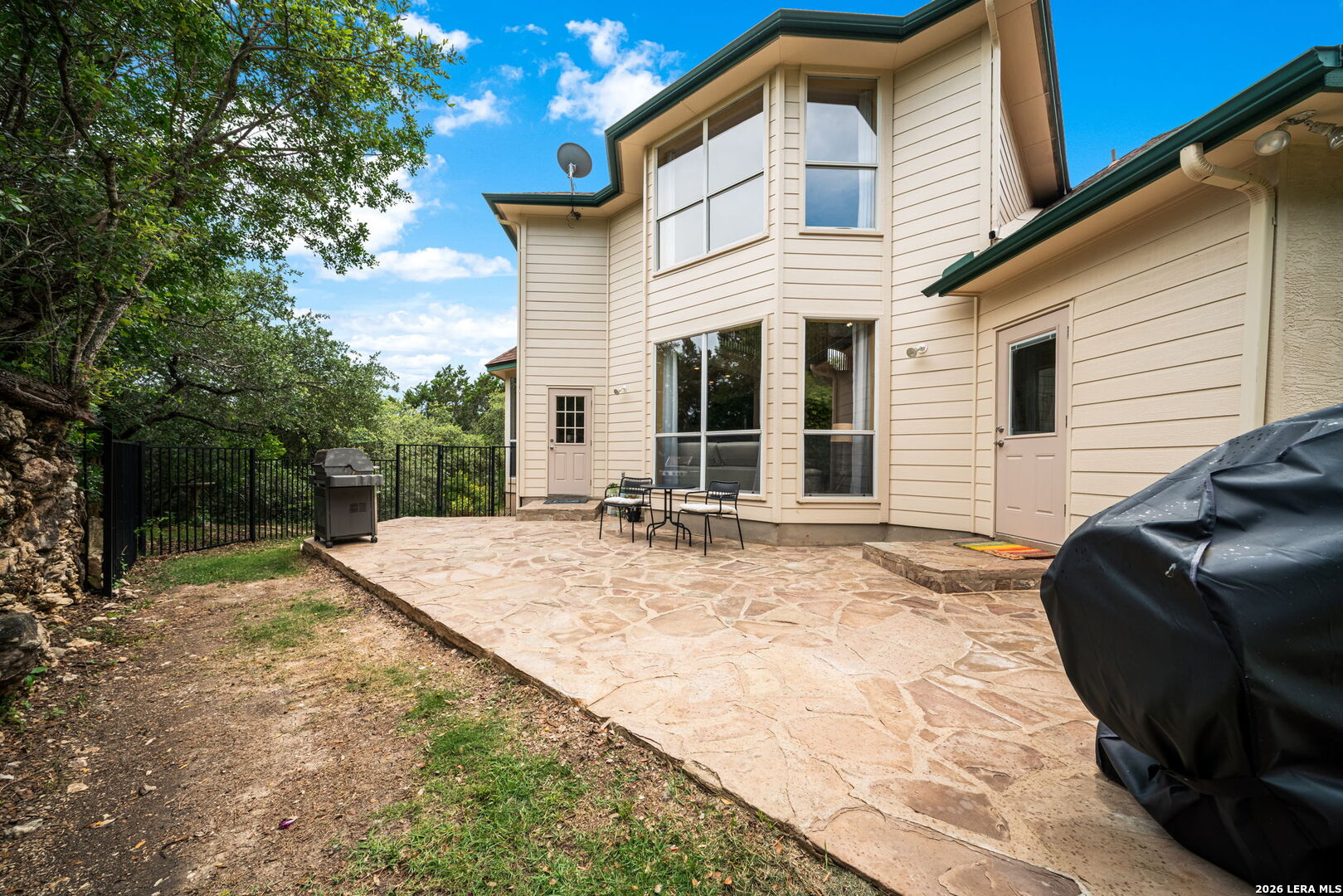 17431 Helotes Spring Road Helotes, TX 78023 - Photo 42 of 50 a view of a house with backyard and sitting area