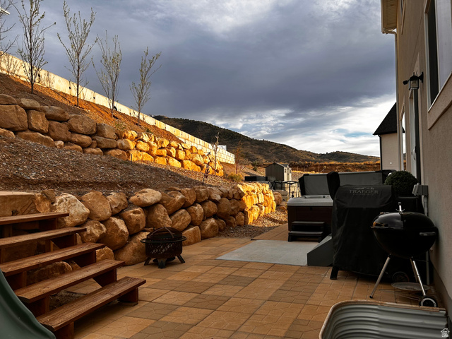 1373 South Raintree Lane Santaquin, UT 84655 - Photo 25 of 29 View of patio / terrace with a mountain view, grilling area, and a fire pit
