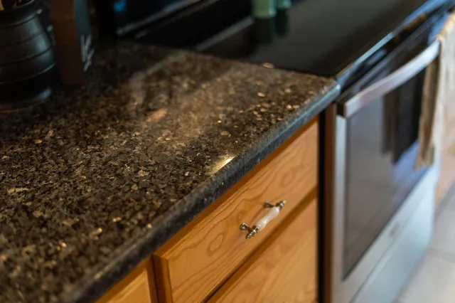 a kitchen with a sink and cabinets