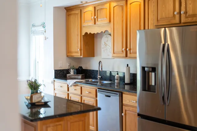 a utility room with sink dryer and washer