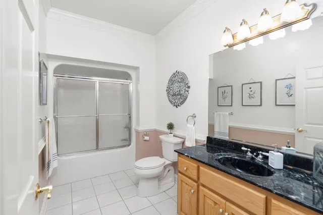 an empty room with a window and a ceiling fan