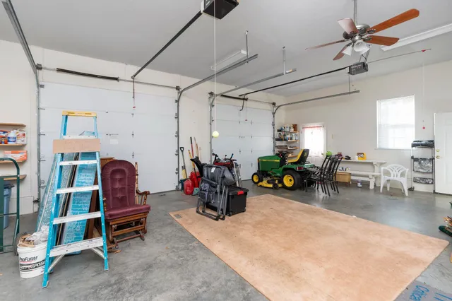 a view of house with backyard and trees