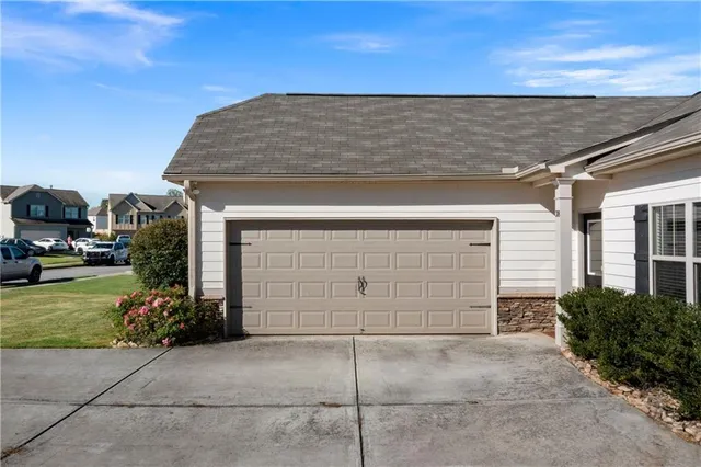 a front view of a house with a garage