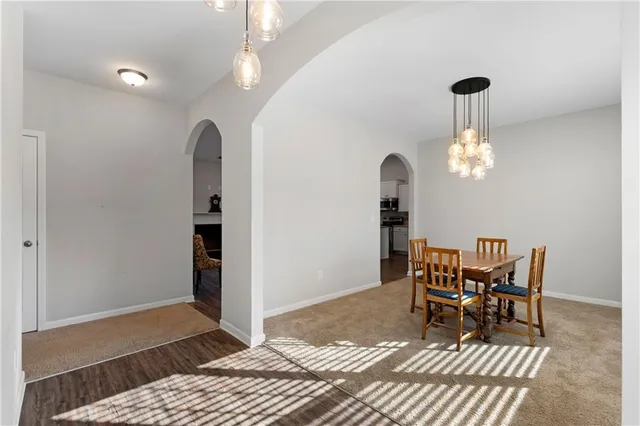 a dining room with furniture and window