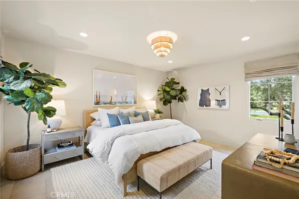 a bedroom with a bed and a couch