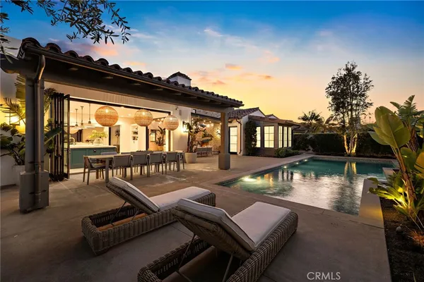 a view of a patio with swimming pool table and chairs