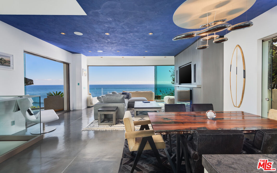 33406 Pacific Coast Highway Malibu, CA 90265 - Photo 12 of 51 a living room with fireplace furniture and a flat screen tv