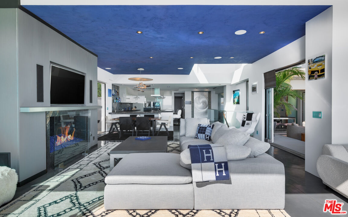 33406 Pacific Coast Highway Malibu, CA 90265 - Photo 14 of 51 a living room with fireplace furniture and a flat screen tv