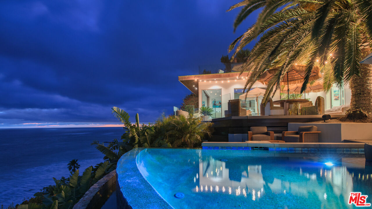 33406 Pacific Coast Highway Malibu, CA 90265 - Photo 2 of 51 a view of a house with backyard water fountain and sitting area