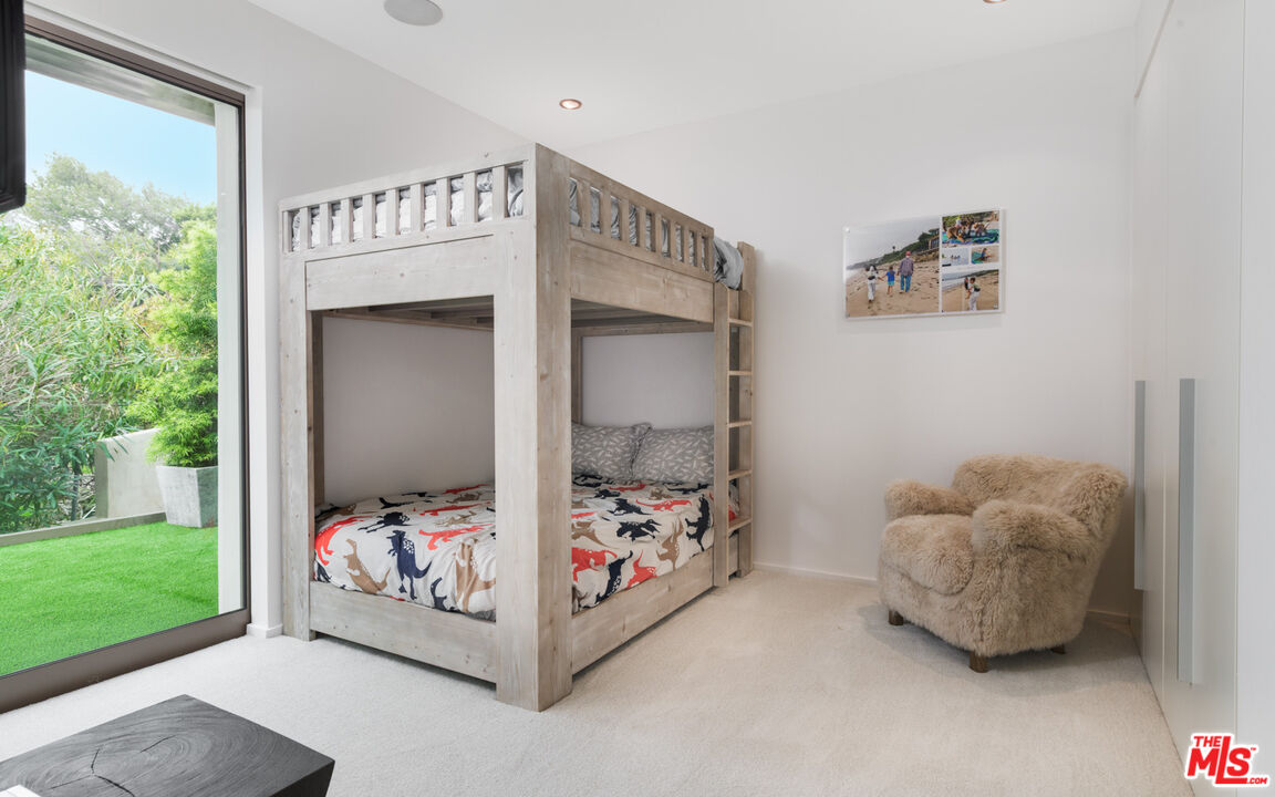 33406 Pacific Coast Highway Malibu, CA 90265 - Photo 24 of 51 a bed room with a bed and a window