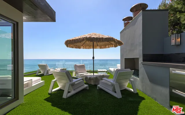 a view of a table and chairs in the patio