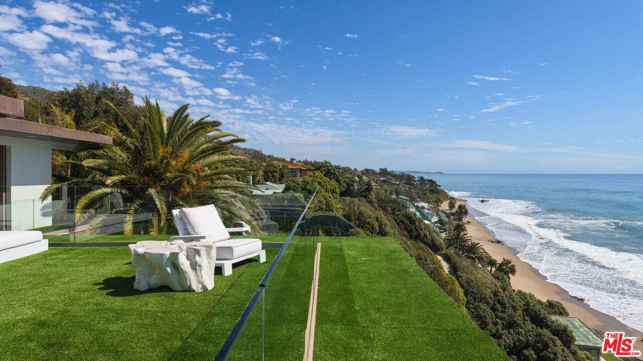 33406 Pacific Coast Highway Malibu, CA 90265 - Photo 34 of 51 a view of a garden with lawn chairs