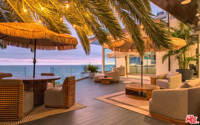a view of a kitchen with dining table and chairs