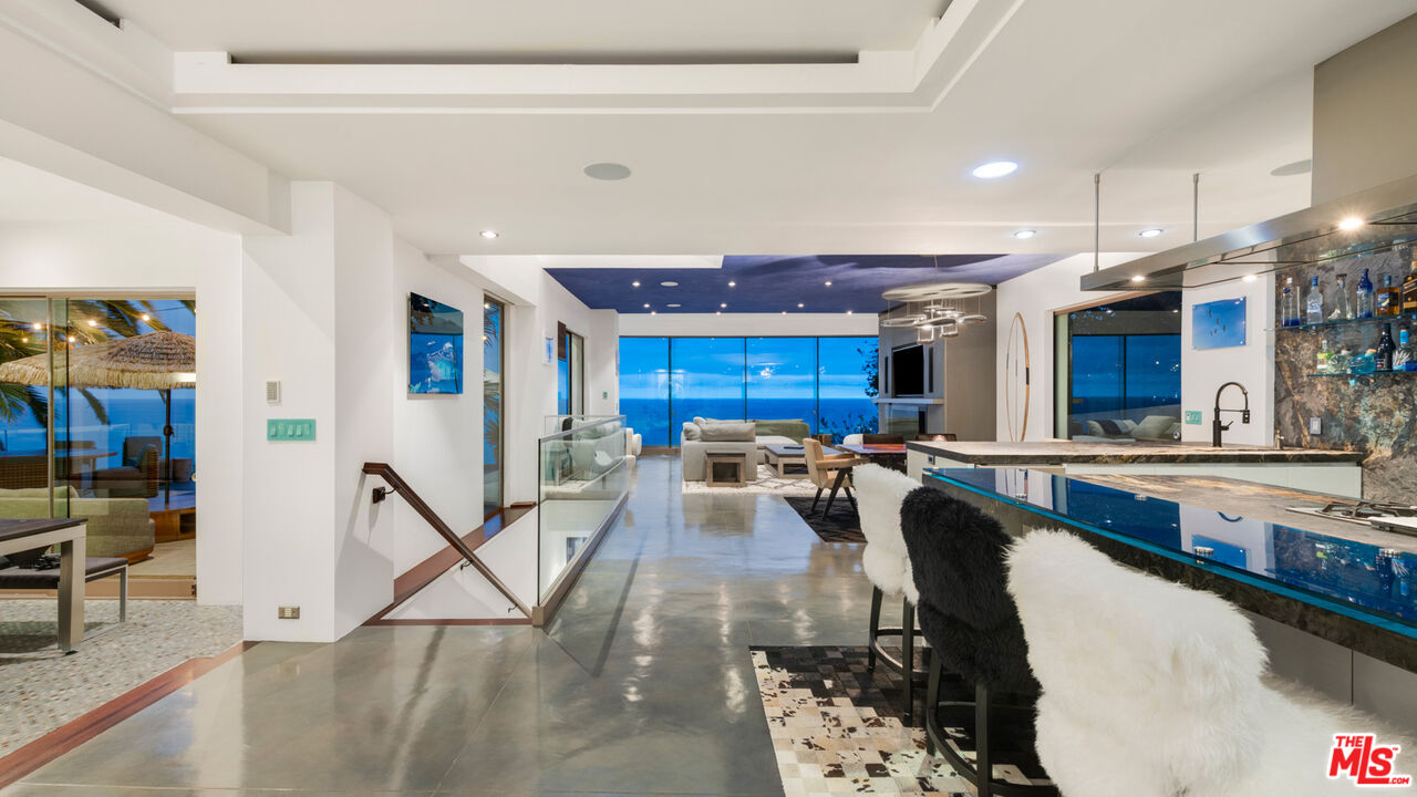 33406 Pacific Coast Highway Malibu, CA 90265 - Photo 38 of 51 a view of a kitchen with dining table and chairs