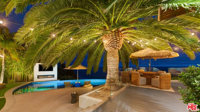 a patio with table and chairs