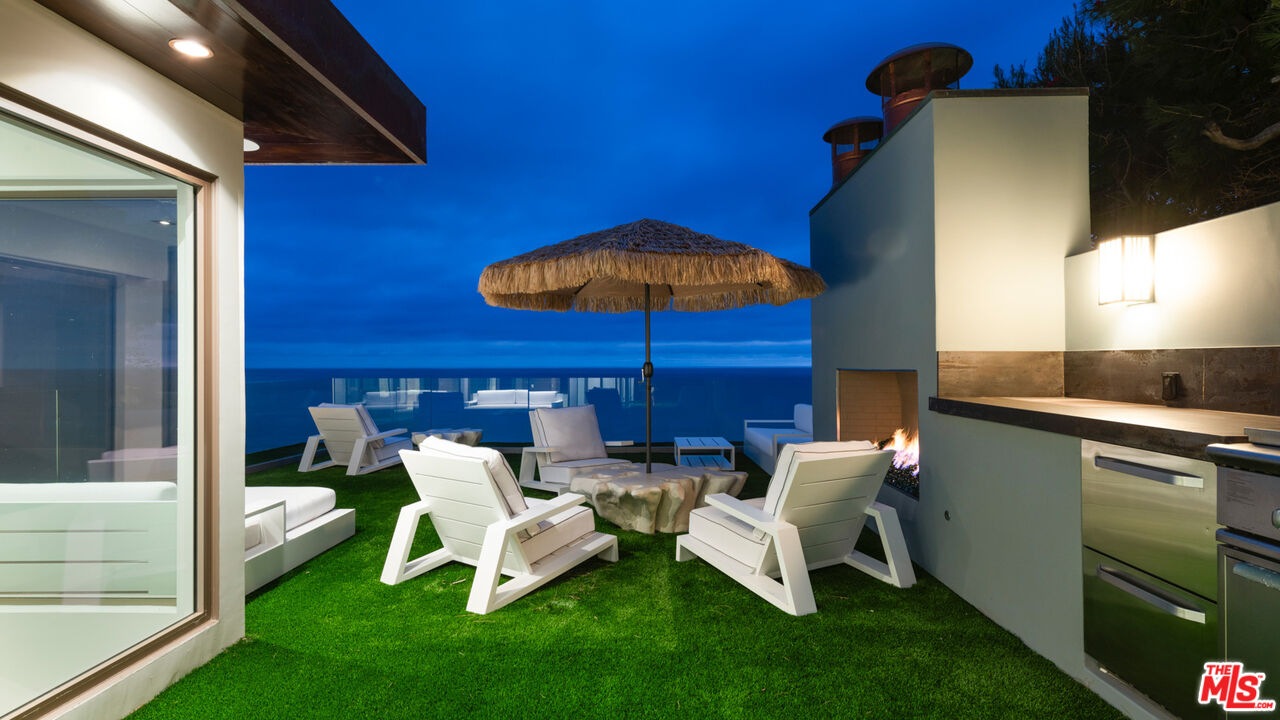 33406 Pacific Coast Highway Malibu, CA 90265 - Photo 47 of 51 a patio with table and chairs
