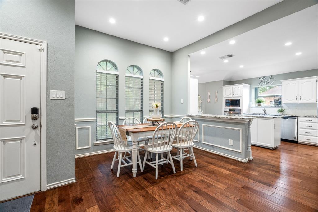 2302 Randi Road Rowlett, TX 75088 - Photo 7 of 33 a view of a dining room with furniture window and wooden floor