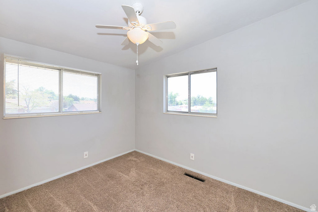 1272 Cook Street Ogden, UT 84404 - Photo 34 of 58 Neutral gray walls with light brown carpet flooring