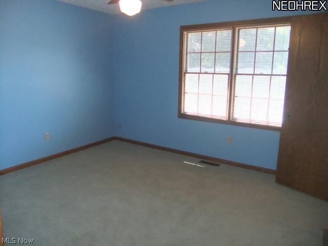 4601 Pinewood Path Akron, OH 44321 - Photo 15 of 23 Upstairs, Bedroom 1 features a ceiling fan and walk-in closet!