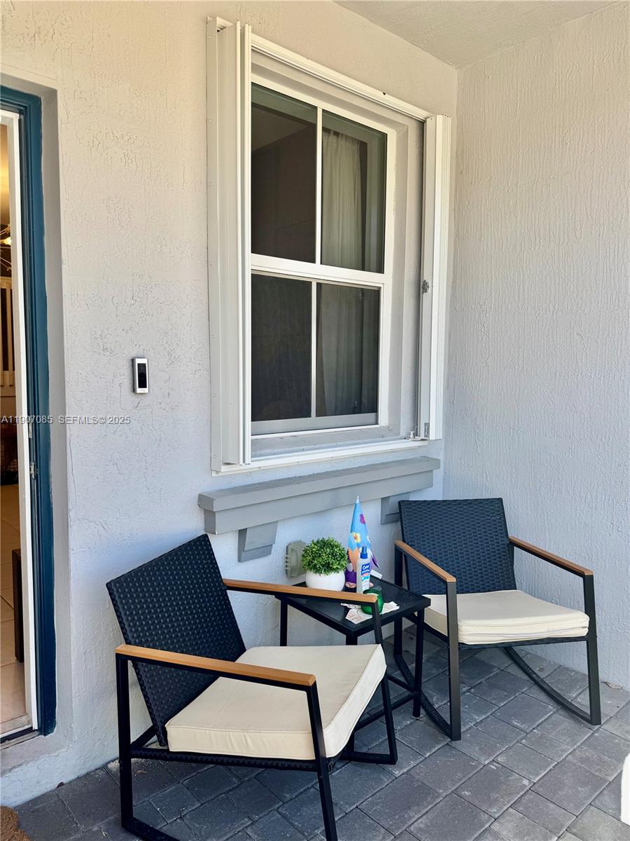 16227 Southwest 291st Street Homestead, FL 33033 - Photo 2 of 4 a outdoor living space with furniture and a window