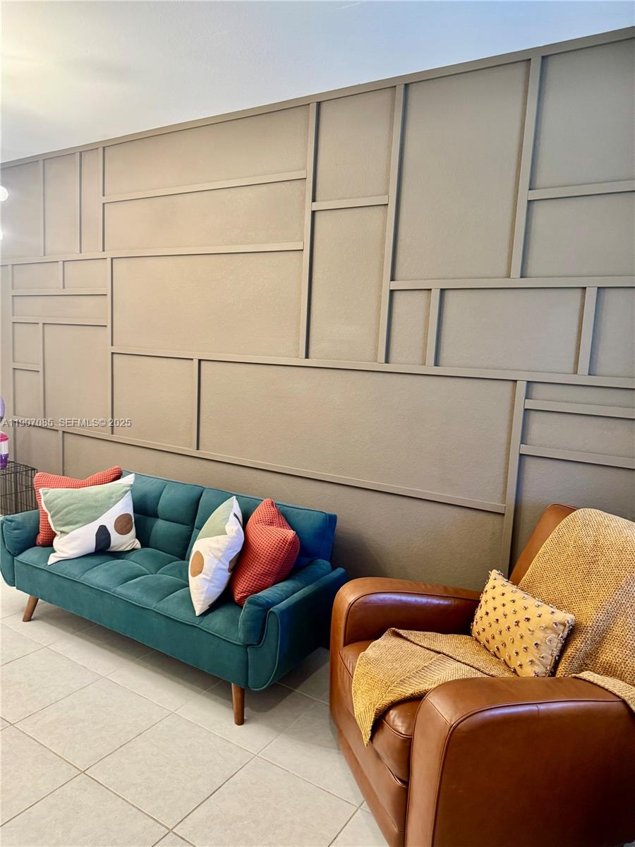 16227 Southwest 291st Street Homestead, FL 33033 - Photo 3 of 4 a bedroom with bed and a couch